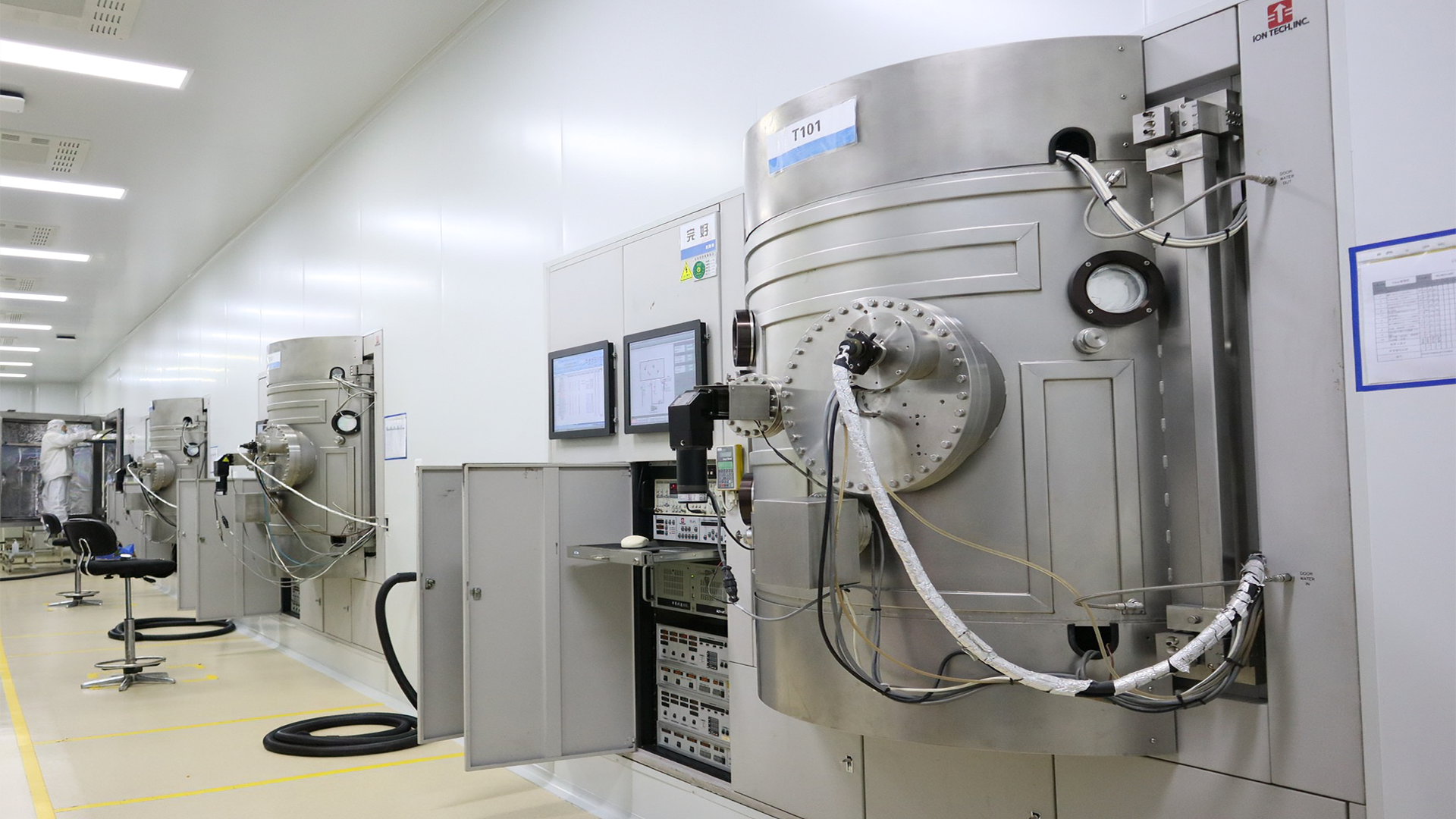 Optical components being processed in a controlled manufacturing environment